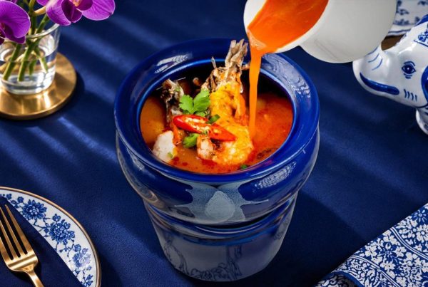 Spicy Thai Tom Yum soup with chilli served in a blue Blue Elephant bowl